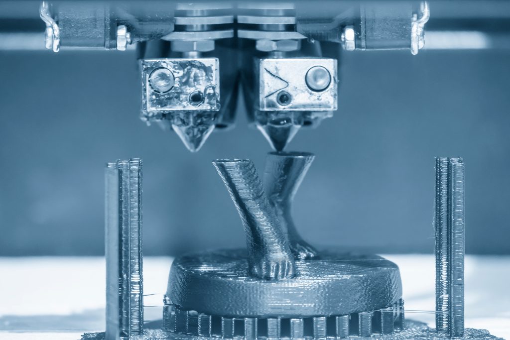 The 3D printing machine operation with the thermoplastic materia
